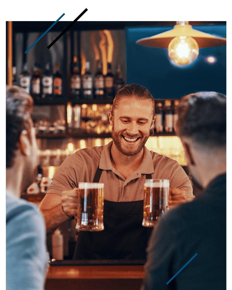 Bartender serving two beers